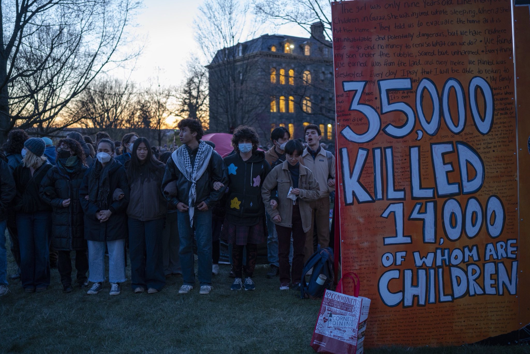 Students rally as the sun sets on the encampment's first day. (Photo: Caleb K for the Ithacan)