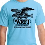 Image of a torso wearing a light blue t-shirt with a flying fish wearing headphones and black text that reads "WRFI Community Radio Live local independent"